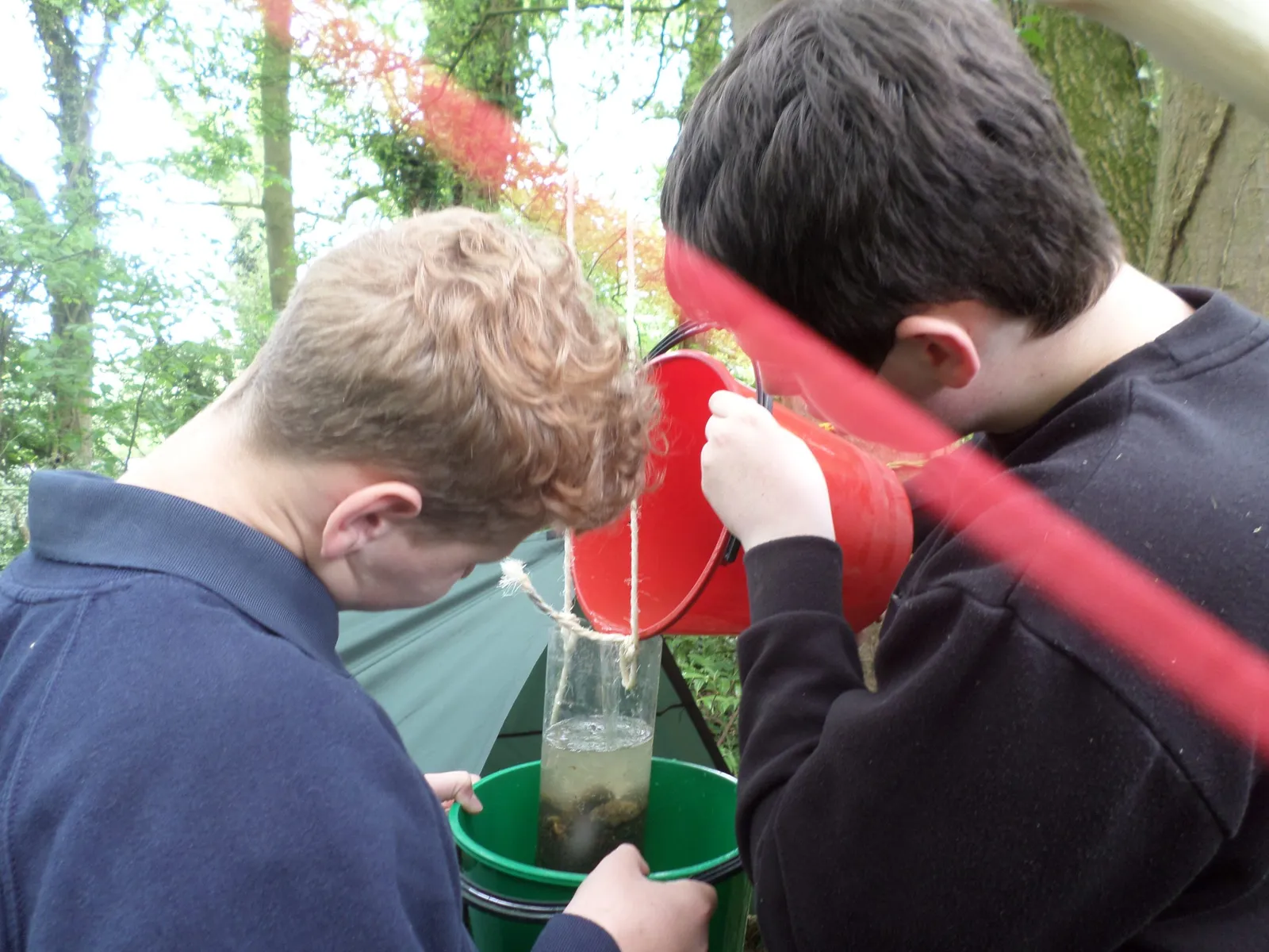 boys creating a natural water filter